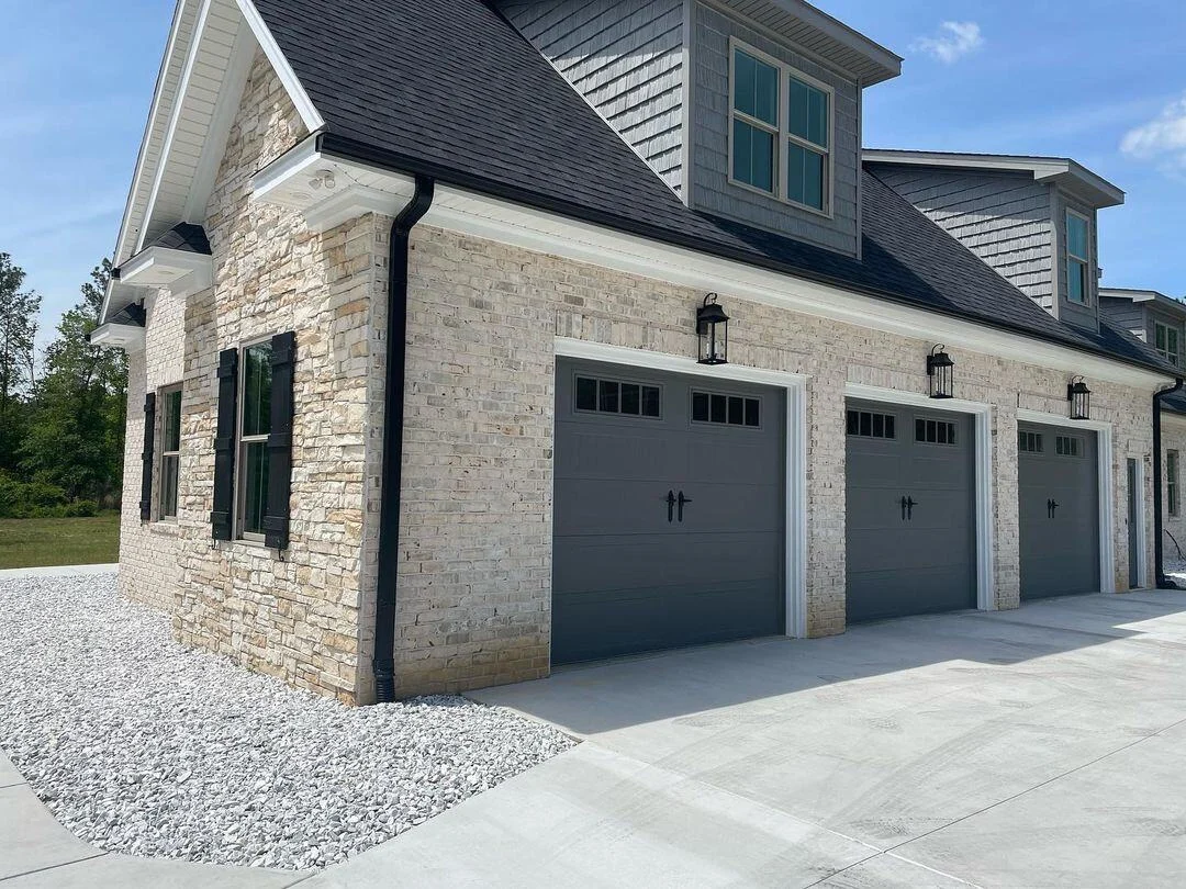 New garage door installation — graphite steel panel door on Chicago residential home