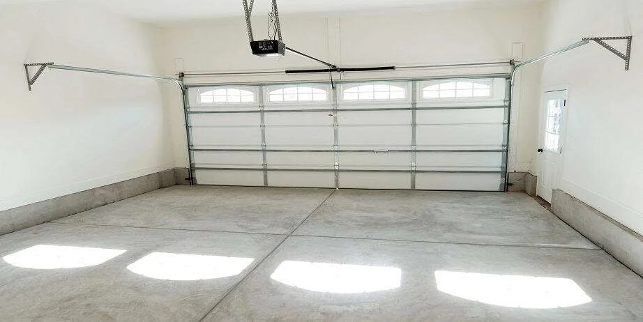 Garage door repair technician servicing a door in Chicago